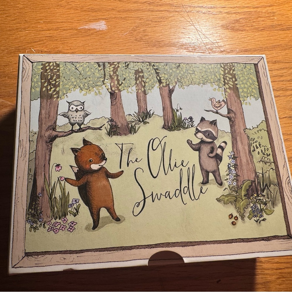 The Ollie Swaddle with Woodland Creatures in Green and Brown